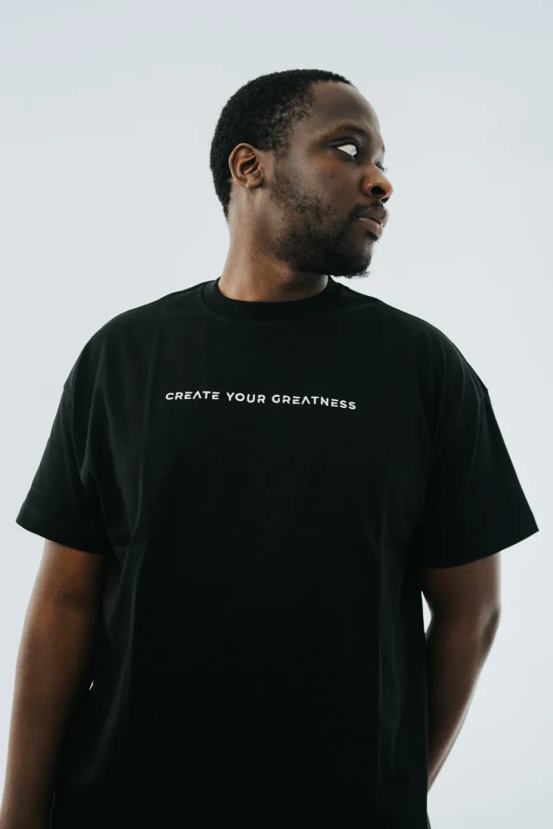 Portrait of a man in a black Create Your Greatness tee